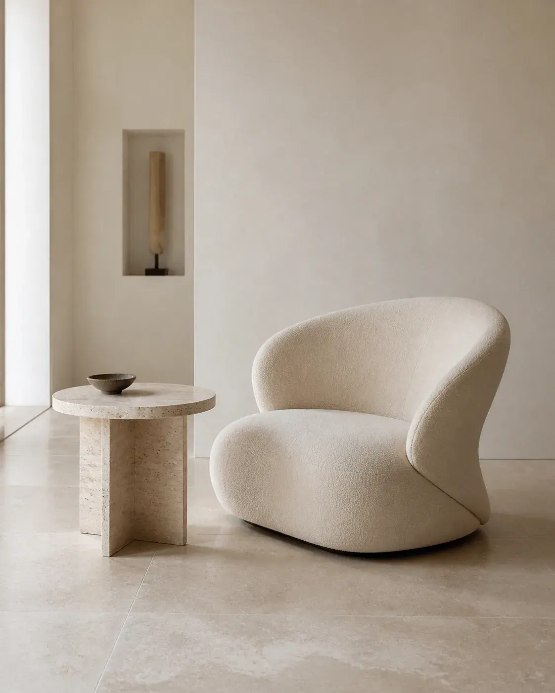 Minimalist AI prompt real output: Minimalist interior photograph of one sculptural cream lounge chair beside a travertine tab